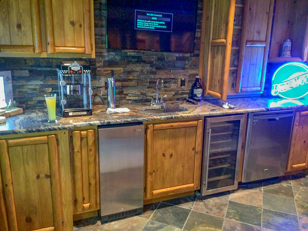 Log & Panel Custom Stained Bar Cabinets
