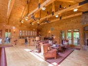 Living Room with White Pine Paneling Ceiling & Timber Trusses