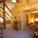 Log Home Loft with Prefinished Knotty Pine Paneling