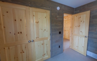 Barnwood_Paneling_Bedroom with our Knotty Pine Doors