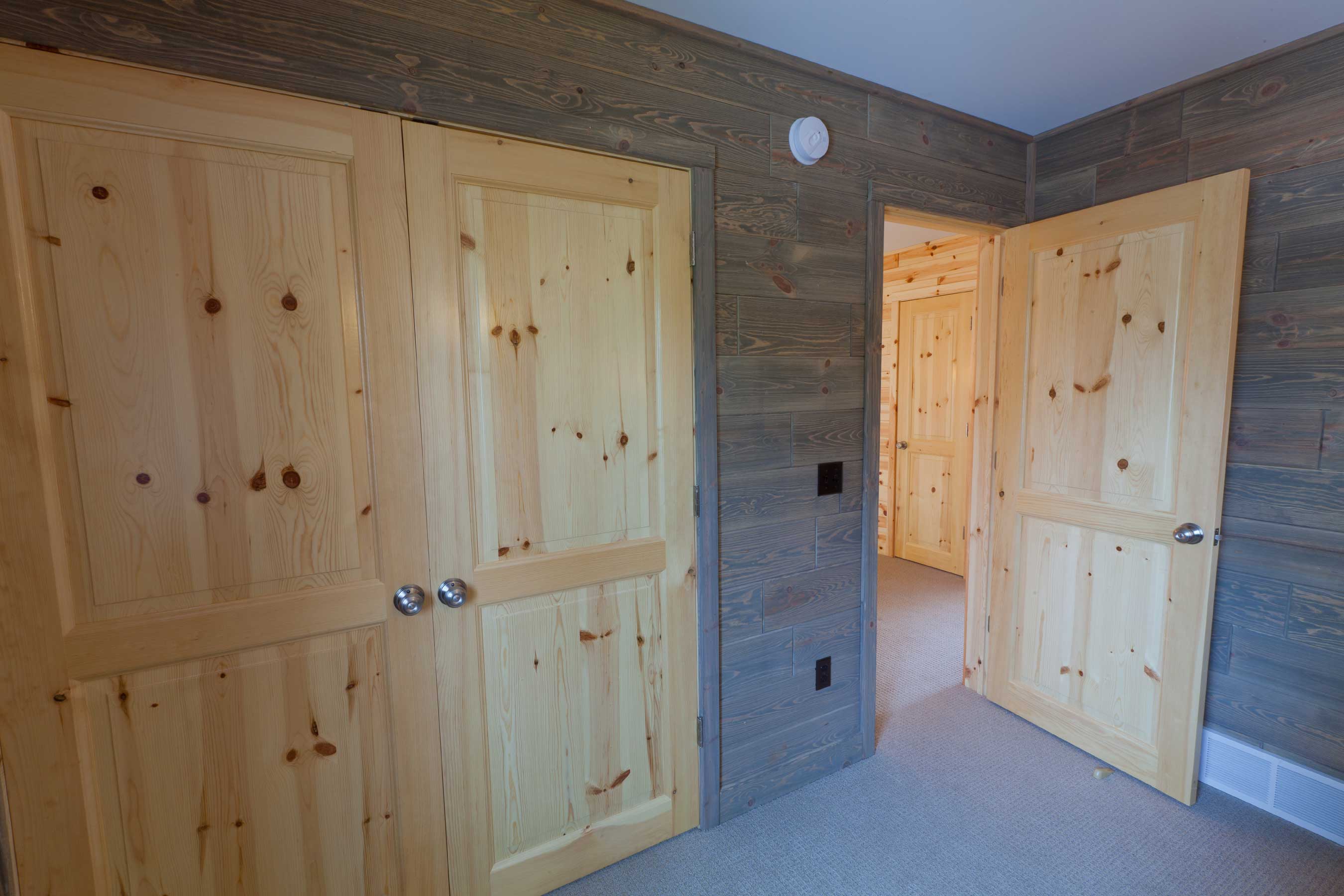Barnwood_Paneling_Bedroom with our Knotty Pine Doors